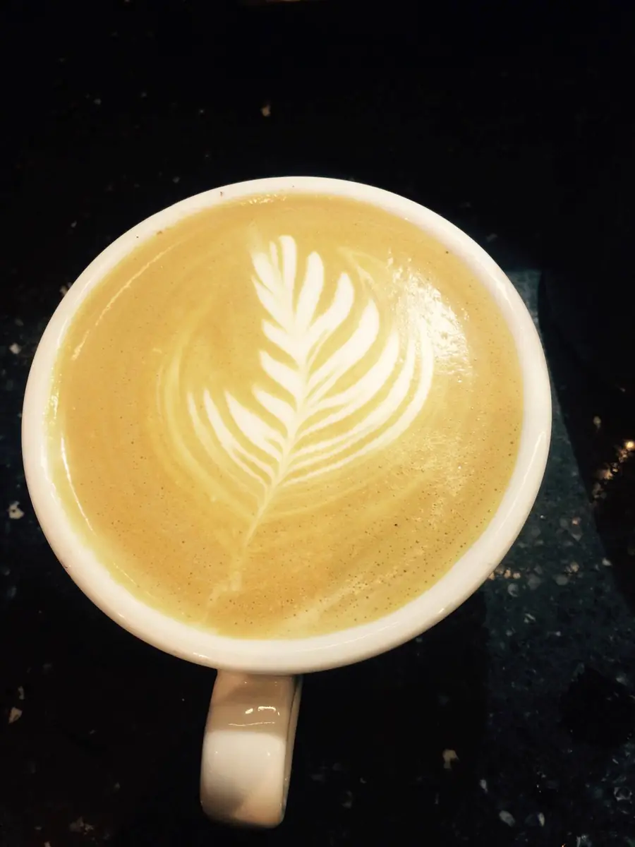 Latte art poured in a ceramic cup